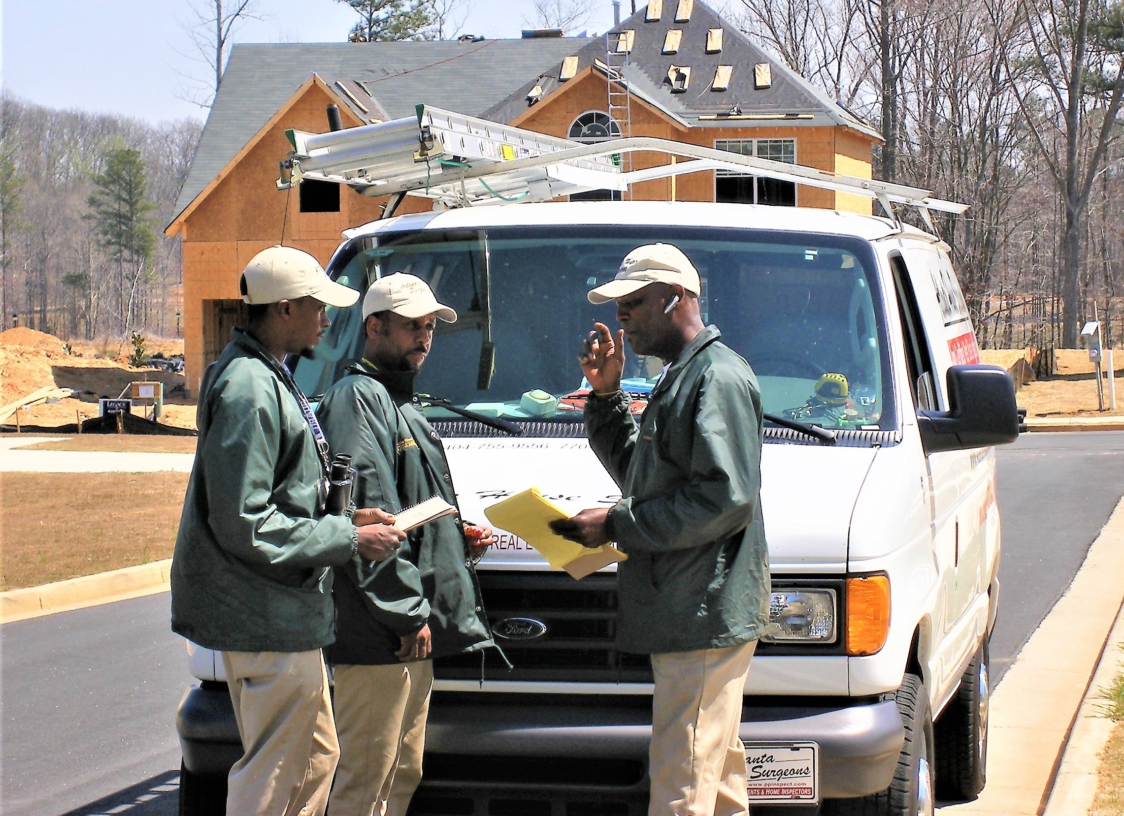 Atlanta House Surgeons employees gathering at a new home subdivision before doing new home inspections.